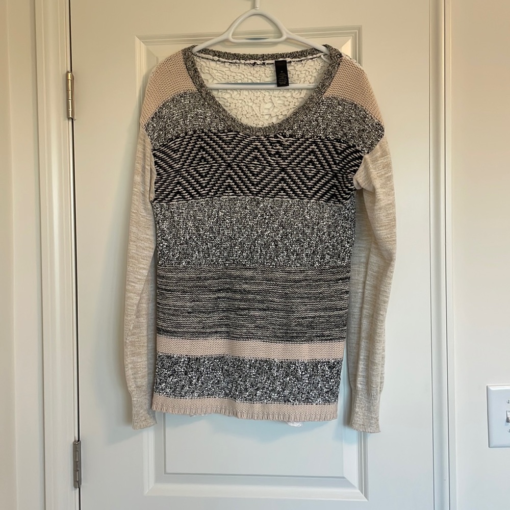 Buckle Crewneck Sweater.Embroidered back.Sleeves have a gold speckle throughout
